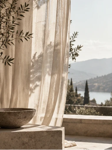 Linen curtains, stone and a quiet lake view